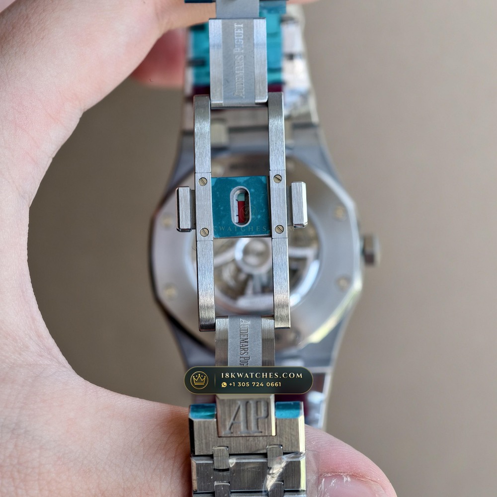 Audemars Piguet Royal Oak Double Balance Wheel Openworked 41mm Baguette Blue Topaz Bezel 18K White Gold Ref. 15412BC.TO.1220BC.01 — Studio Angle 16 in 18K White Gold Au750 (224.8g Verified Mass, Audemars Piguet Cal. 3132 Dual-Balance Openworked)