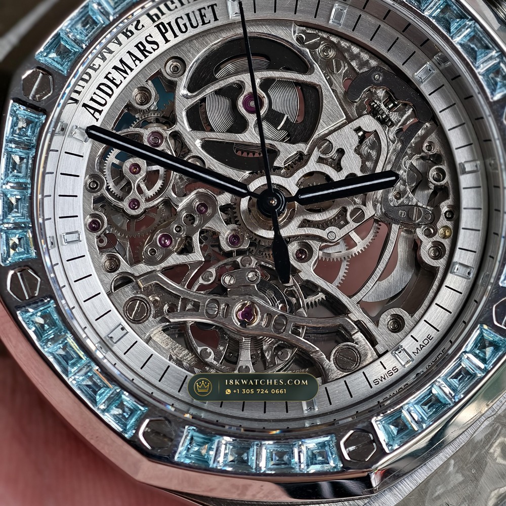 Audemars Piguet Royal Oak Double Balance Wheel Openworked 41mm Baguette Blue Topaz Bezel 18K White Gold Ref. 15412BC.TO.1220BC.01 — Studio Angle 17 in 18K White Gold Au750 (224.8g Verified Mass, Audemars Piguet Cal. 3132 Dual-Balance Openworked)