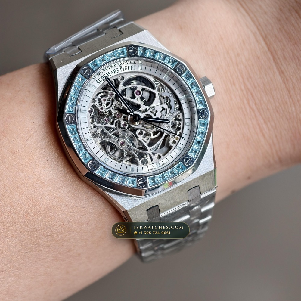Audemars Piguet Royal Oak Double Balance Wheel Openworked 41mm Baguette Blue Topaz Bezel 18K White Gold Ref. 15412BC.TO.1220BC.01 — Studio Angle 19 in 18K White Gold Au750 (224.8g Verified Mass, Audemars Piguet Cal. 3132 Dual-Balance Openworked)