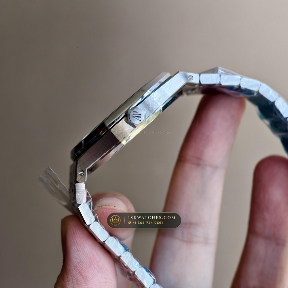Audemars Piguet Royal Oak Double Balance Wheel Openworked 41mm Baguette Blue Topaz Bezel 18K White Gold Ref. 15412BC.TO.1220BC.01 — Studio Gallery Plate IX in 18K White Gold Au750 (224.8g Verified Mass, Audemars Piguet Cal. 3132 Dual-Balance Openworked)