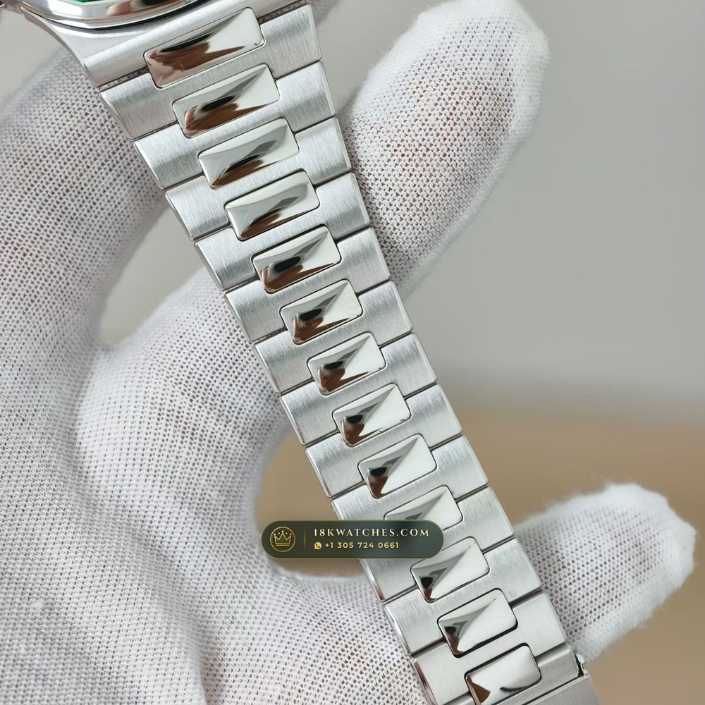 Patek Philippe Nautilus Self-Winding Baguette Emerald Bezel 950 Platinum Ref. 5711/113P-001 — Studio Gallery Plate VI in 950 Platinum Pt950 (245.4g Verified Mass, Patek Philippe Cal. 26-330 S C / Cal. 324 S C - 21K Gold Rotor)