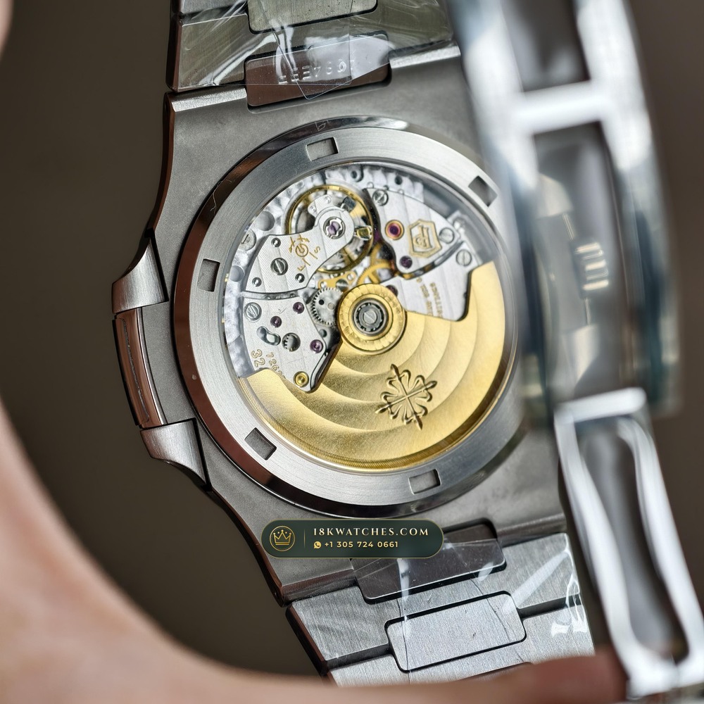 Patek Philippe Nautilus Off-Catalogue Baguette Emerald Bezel 950 Platinum Ref. 5711/113P-001 — Studio Gallery Plate VII in 950 Platinum Pt950 (245.2g Verified Mass, Patek Philippe Cal. 26-330 S C / Cal. 324 S C - 21K Gold Rotor)