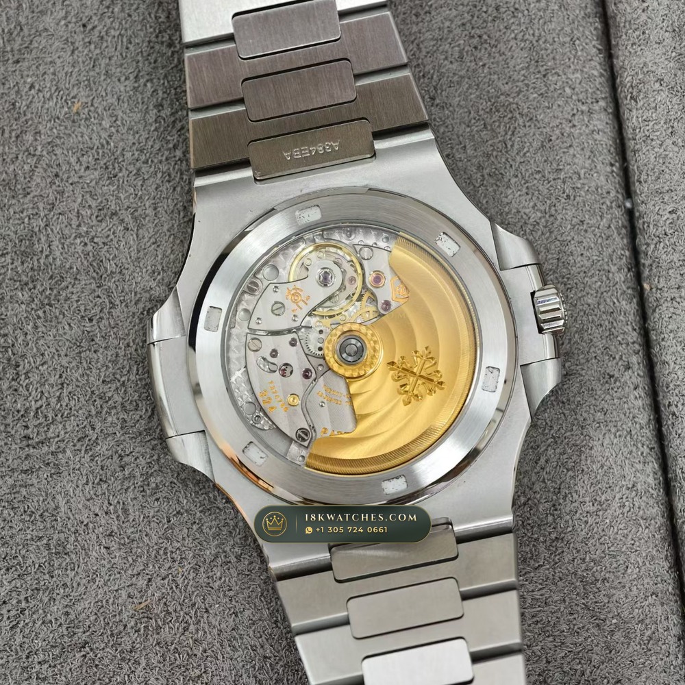 Patek Philippe Nautilus Self-Winding Baguette Ruby Bezel 950 Platinum Ref. 5711/112P-001 — Studio Gallery Plate VII in 950 Platinum Pt950 (245.1g Verified Mass, Patek Philippe Cal. 26-330 S C / Cal. 324 S C - 21K Gold Rotor)