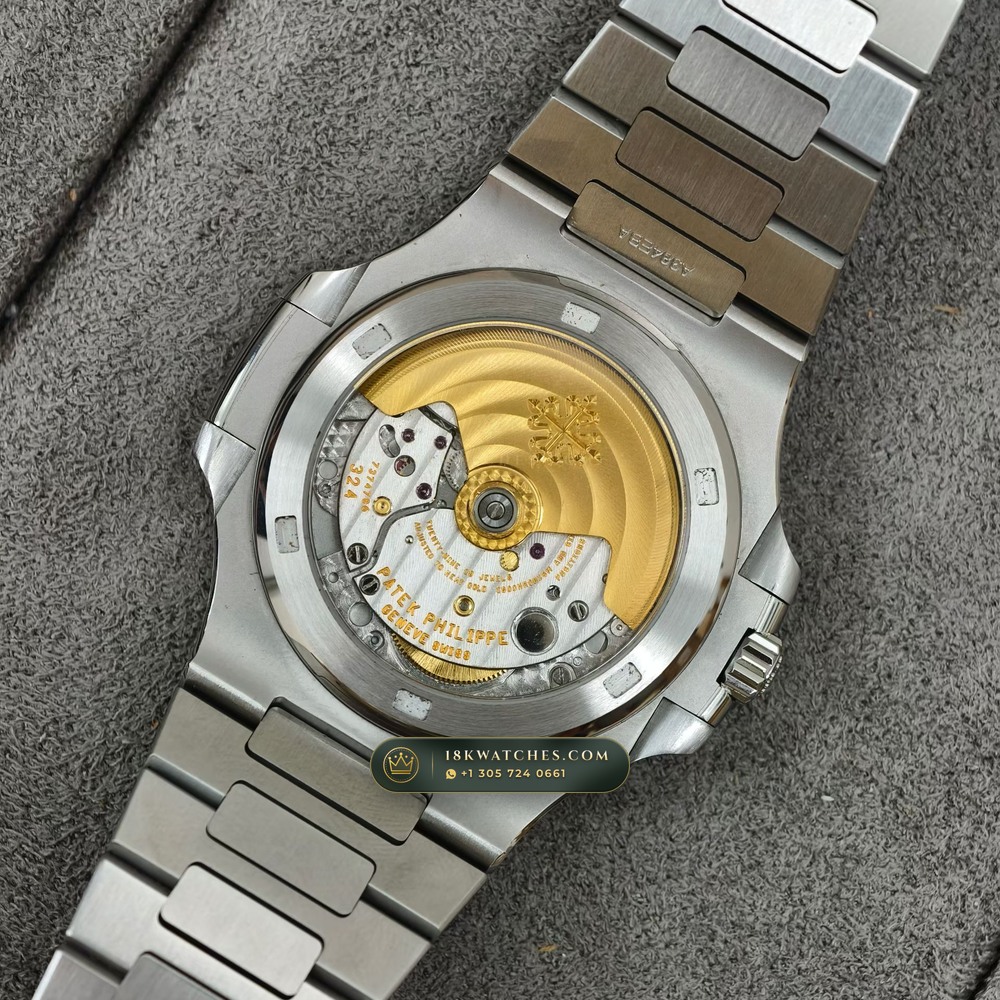 Patek Philippe Nautilus Self-Winding Baguette Ruby Bezel 950 Platinum Ref. 5711/112P-001 — Studio Gallery Plate VIII in 950 Platinum Pt950 (245.1g Verified Mass, Patek Philippe Cal. 26-330 S C / Cal. 324 S C - 21K Gold Rotor)