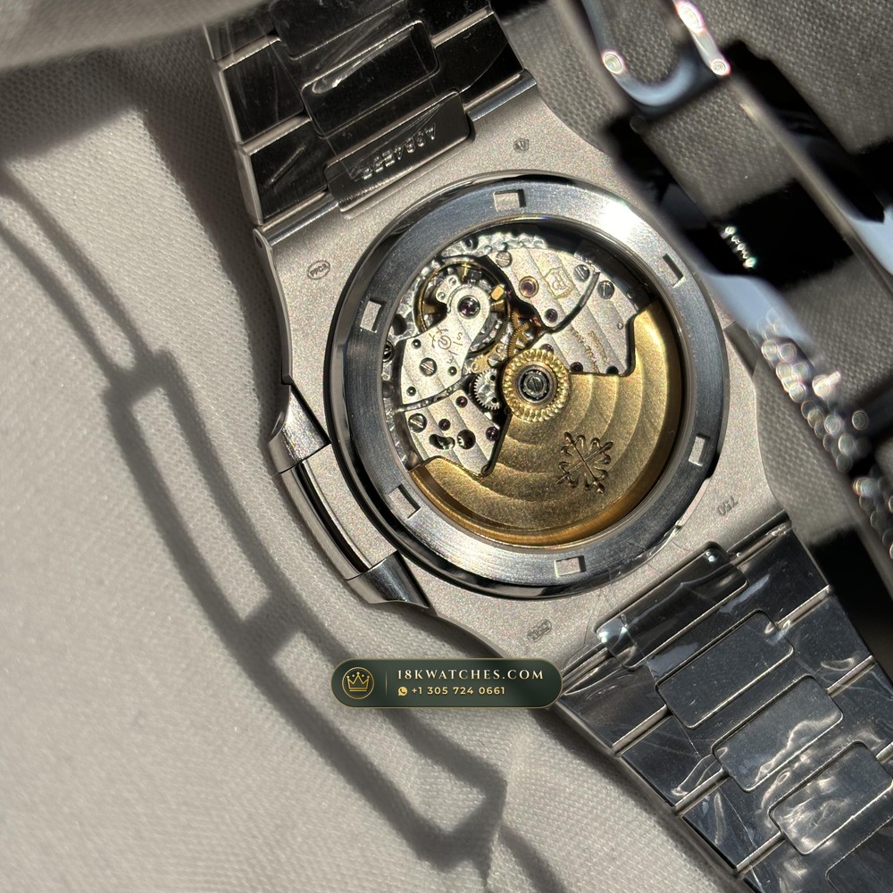 Patek Philippe Nautilus Off-Catalogue Baguette Ruby Bezel Diamond-Set Bezel 950 Platinum Ref. 5711/112P-001 — Studio Gallery Plate VIII in 950 Platinum Pt950 (244.6g Verified Mass, Patek Philippe Cal. 26-330 S C / Cal. 324 S C - 21K Gold Rotor)