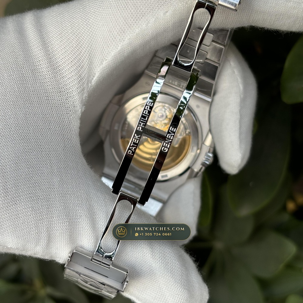 Patek Philippe Nautilus Off-Catalogue Baguette Ruby Bezel Diamond-Set Bezel 950 Platinum Ref. 5711/112P-001 — Studio Gallery Plate IX in 950 Platinum Pt950 (244.6g Verified Mass, Patek Philippe Cal. 26-330 S C / Cal. 324 S C - 21K Gold Rotor)