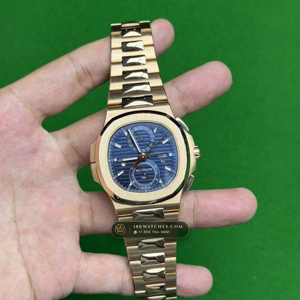 Patek Philippe Nautilus Travel Time Chronograph Sunburst Blue Dial 18K Rose Gold Ref. 5990/1R-001