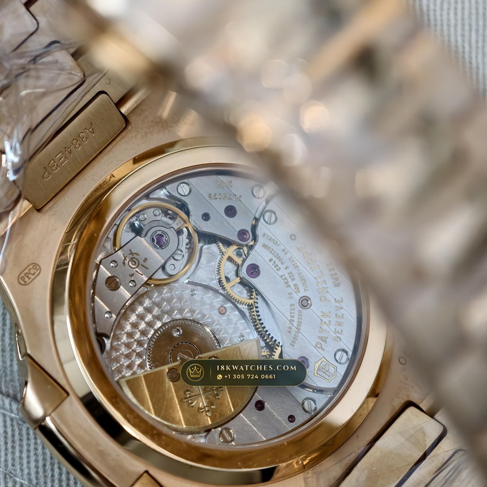 Patek Philippe Nautilus Moonphase & Power Reserve Diamond-Set Bezel 18K Rose Gold Ref. 5712R — Studio Gallery Plate IX in 18K Rose Gold Au750 (106.0g Verified Mass, Patek Philippe Cal. 240 PS IRM C LU - 22K Gold Micro-Rotor)