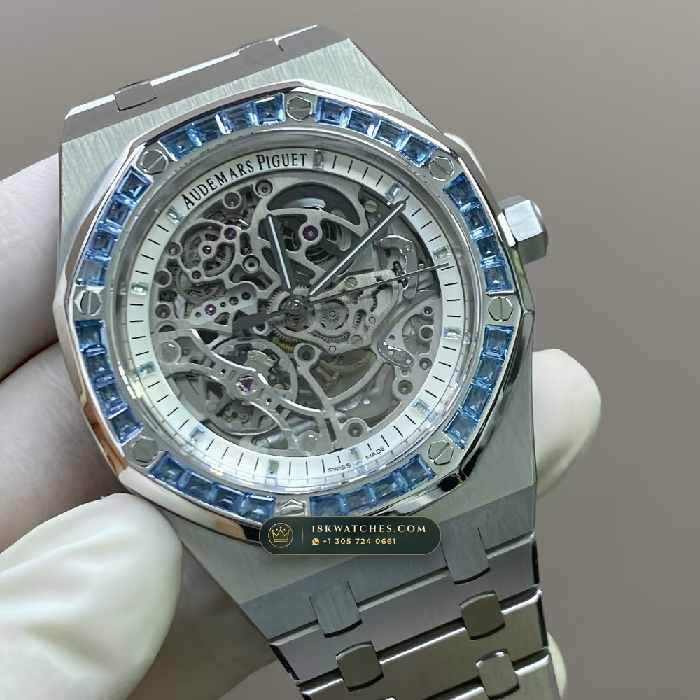 Audemars Piguet Royal Oak Double Balance Wheel Openworked 41mm Baguette Blue Topaz Bezel 18K White Gold Free-Sprung Calibre Ref. 15412BC.TO.1220BC.01 — Studio Gallery Plate V in 18K White Gold Au750 (224.5g Verified Mass, Audemars Piguet Cal. 3132 Dual-Balance Openworked)