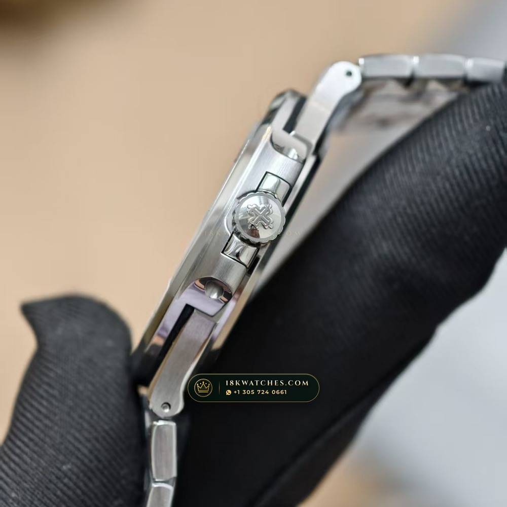 Patek Philippe Nautilus Self-Winding Baguette Emerald Bezel 950 Platinum 22K Gold Rotor Ref. 5711/113P-001 — Studio Gallery Plate X in 950 Platinum Pt950 (244.9g Verified Mass, Patek Philippe Cal. 26-330 S C / Cal. 324 S C - 21K Gold Rotor)
