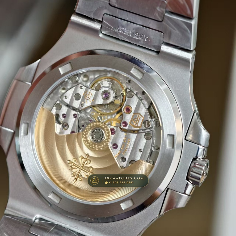 Patek Philippe Nautilus Self-Winding Baguette Emerald Bezel 950 Platinum 22K Gold Rotor Ref. 5711/113P-001 — Studio Gallery Plate XI in 950 Platinum Pt950 (244.9g Verified Mass, Patek Philippe Cal. 26-330 S C / Cal. 324 S C - 21K Gold Rotor)
