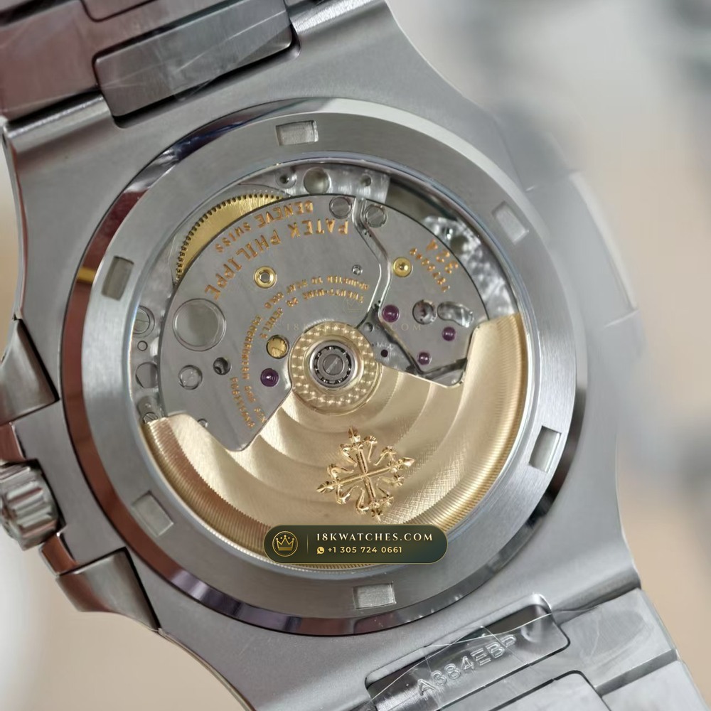 Patek Philippe Nautilus Self-Winding Baguette Emerald Bezel 950 Platinum 22K Gold Rotor Ref. 5711/113P-001 — Studio Gallery Plate XIV in 950 Platinum Pt950 (244.9g Verified Mass, Patek Philippe Cal. 26-330 S C / Cal. 324 S C - 21K Gold Rotor)
